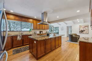 Kitchen with breakfast nook and living space with fireplace