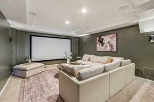 Home theater room with projector, screen and surround sound