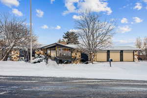 Front of property with 3 car garage