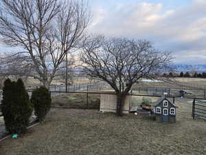 View of yard featuring a rural view and a mountain view