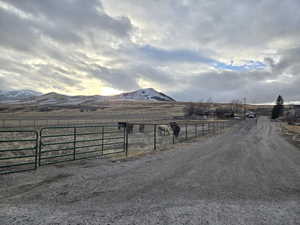 View of road with a rural view and a mountain view