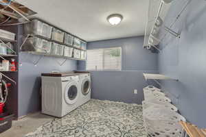 Extra large daylight laundry room with lots of shelving for storage.