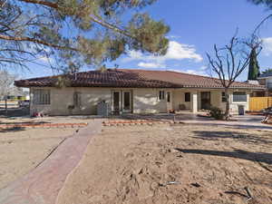 Back of property featuring a patio area and central AC