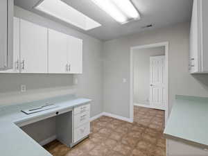 Unfurnished office with a textured ceiling