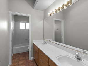 Full bathroom featuring toilet, tile patterned flooring, tub / shower combination, and vanity