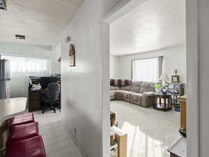 Interior space featuring a textured ceiling