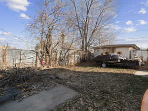 View of backyard from back door. Concrete cement pad driveway can park 3 to 4 cars.