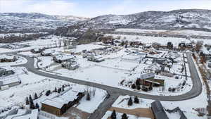 Snowy aerial view with a mountain view