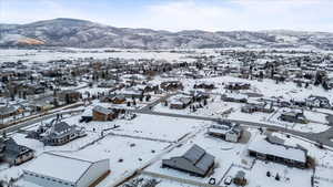 Snowy aerial view with a mountain view