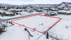 Snowy aerial view with a mountain view