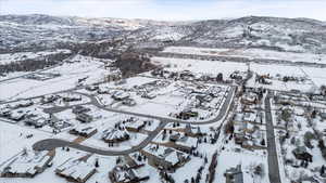 Snowy aerial view featuring a mountain view