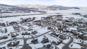 Snowy aerial view featuring a mountain view