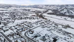 Snowy aerial view featuring a mountain view