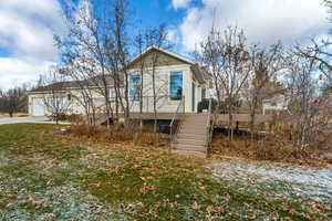 View of rear of house with a front yard