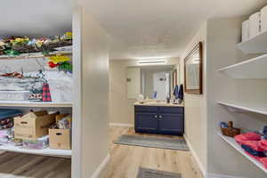 Bathroom featuring vanity and hardwood / wood-style flooring