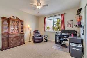 Bedroom featuring carpet floors and ceiling fan