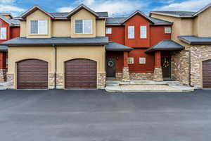 View of front facade featuring a garage