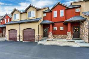 View of front facade featuring a garage