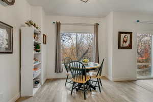 Dining room with light hardwood / wood-style floors