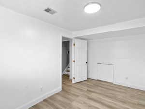 Unfurnished room featuring light wood-style flooring