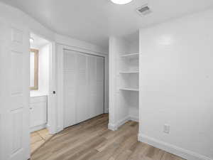 Bedroom with light wood-style floors