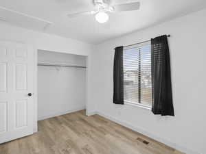 Bedroom featuring a closet, ceiling fan, and light wood-type flooring