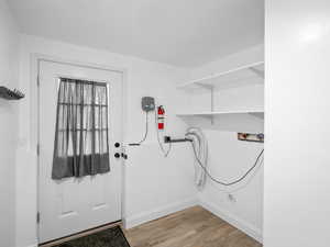 Basement Laundry room with door to backyard