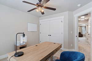 Bedroom #3 upstairs. double doors to closet. Carpeted office with ceiling fan