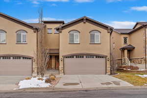 End Unit!  3 bedroom 4 baths townhome. View of front of property with a garage. Basement can also be used as bedroom with built in Murphy Bed