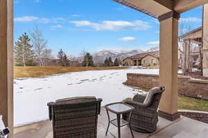 back patio with a view to the North East. NO neighbors overly close looking out. Snow covered patio featuring a mountain view