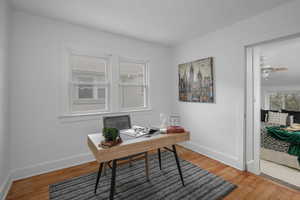 Office area featuring hardwood / wood-style flooring and ceiling fan