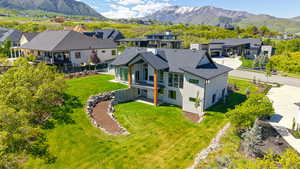 Aerial perspective of suburban area featuring a mountain backdrop