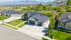 Aerial view of residential area featuring a mountainous background