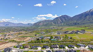 Aerial view of residential area featuring a mountainous background