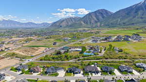 View of property location featuring nearby suburban area and a mountainous background