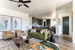 Living room with ceiling fan with large open entertaining space.  Photo of Finland Model Home not subject property