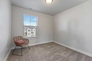 Unfurnished room featuring light colored carpet