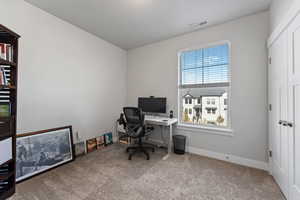 Office area featuring carpet flooring