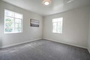 View of carpeted spare room