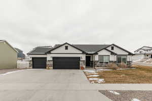 Craftsman house with a front lawn and a garage