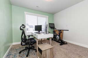 Office featuring light colored carpet