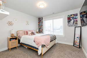 Bedroom featuring carpet flooring