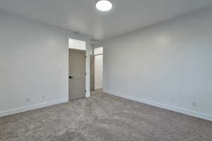 Empty room featuring carpet flooring