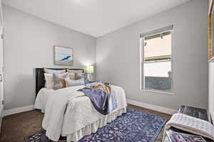 Bedroom with dark colored carpet