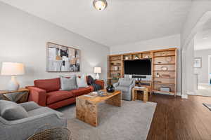 Living room with hardwood / wood-style floors