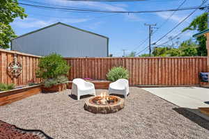 View of patio / terrace with an outdoor fire pit