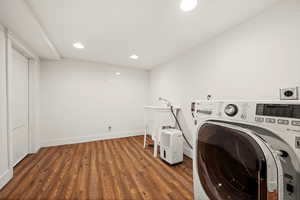 Laundry room with washer / dryer and dark hardwood / wood-style floors