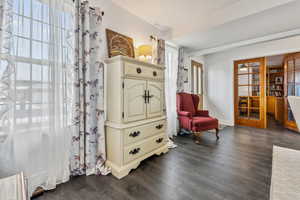 Sitting room with dark hardwood / wood-style floors