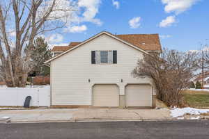 View of side of property with a garage