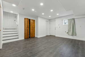 Basement featuring dark hardwood / wood-style flooring